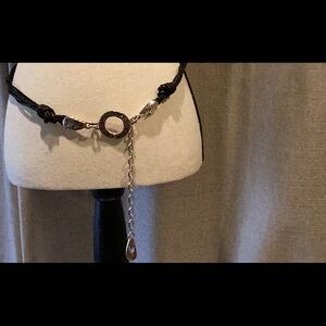 Women’s Black and Silver braided belt with silver clasp, size medium.